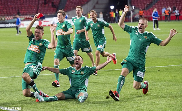 Four-times European champions Ajax were knocked out by Rapid Vienna in Amsterdam on Tuesday night