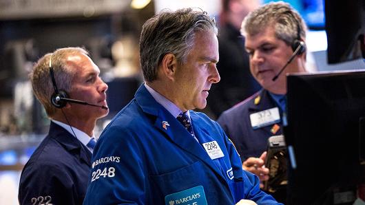 Traders work on the floor of the New York Stock Exchange