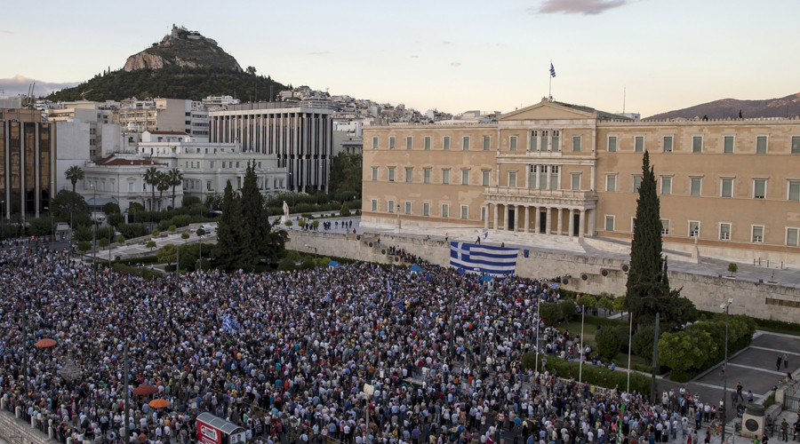 Protesters attend a rally in front of the parliament building calling on the government to clinch a deal with its international creditors and secure Greece's future in the Eurozone in Athens Greece