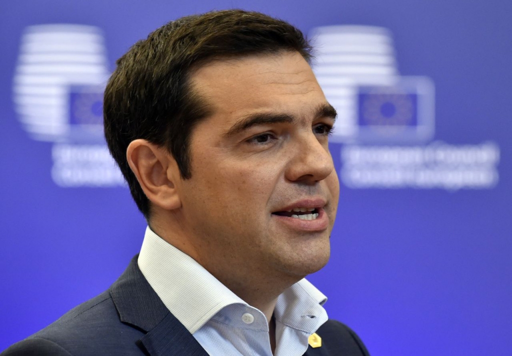 Greek Prime Minister Alexis Tsipras answers journalists questions after an EU summit at the EU headquarters in Brussels