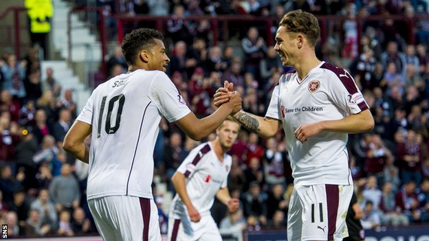 Osman Sow celebrates his penalty with Hearts team-mate Sam Nicholson