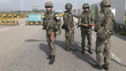 South Korean soldiers stand guard on Unification Bridge which leads to the demilitarised zone