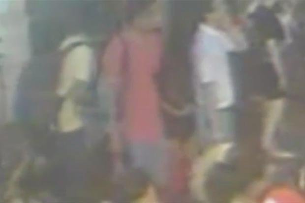 IG    
     SUSPECTS Two men seen here wearing red and white Tshirts have handed themselves into Thai police