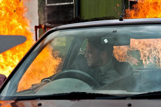 Adam awakes to find that the car he's sleeping in is on fire. Can Adam get out before the heat and fumes overpower him