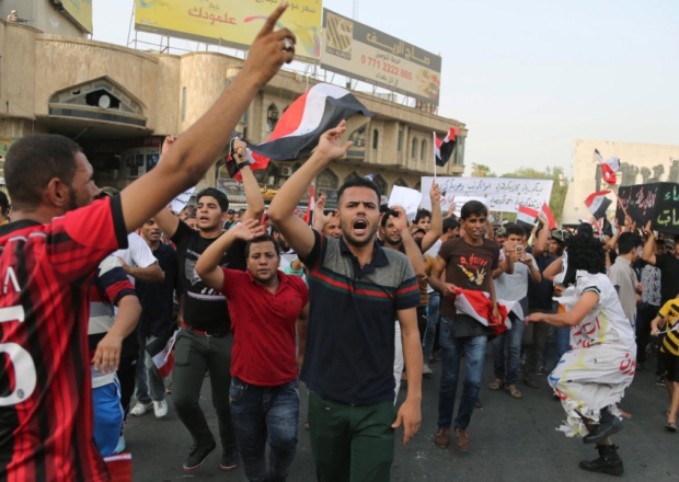 Protesters chant anti Iraqi government slogans in Tahrir Square in Baghdad