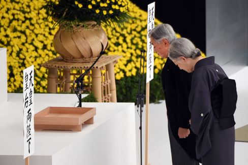 Emperor Akihito left and Empress Michiko offer silence prayers before the altar during the annual memorial service for war victims in Tokyo on Saturday