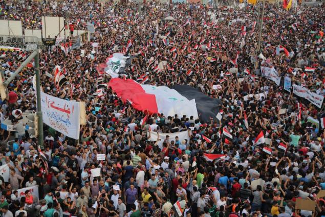 Thousands of Iraqis braved the scorching summer heat to stage a huge protest in central Baghdad