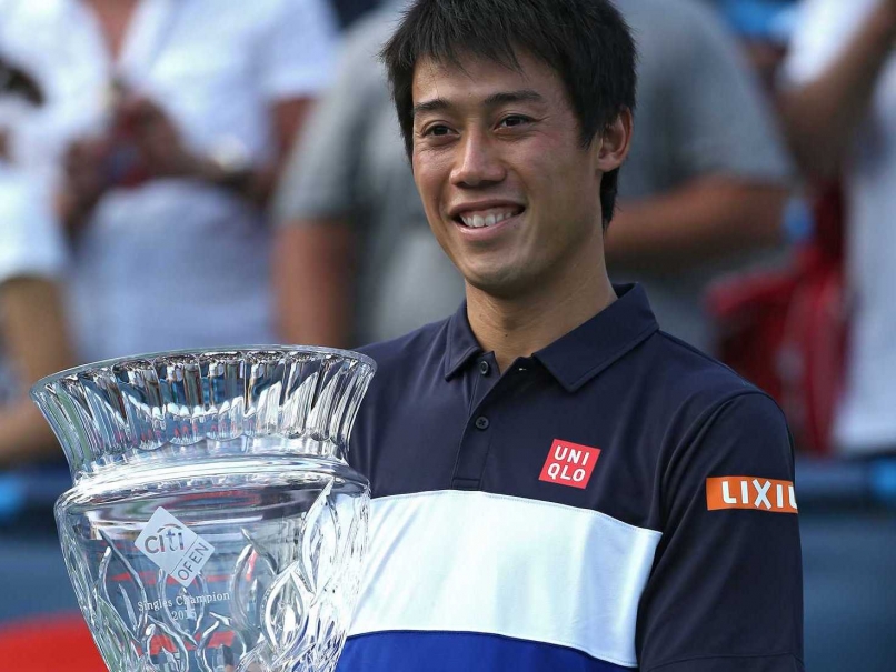 Kei Nishikori poses with his Washwington Open title