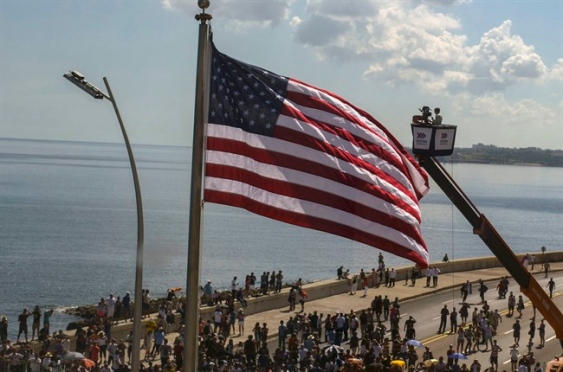 Kerry calls for 'genuine democracy' as Stars and Stripes is raised over US 