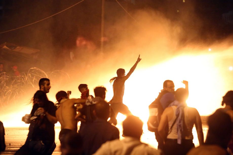 Beirut residents clash with riot police after a demonstration to protest the garbage crisis