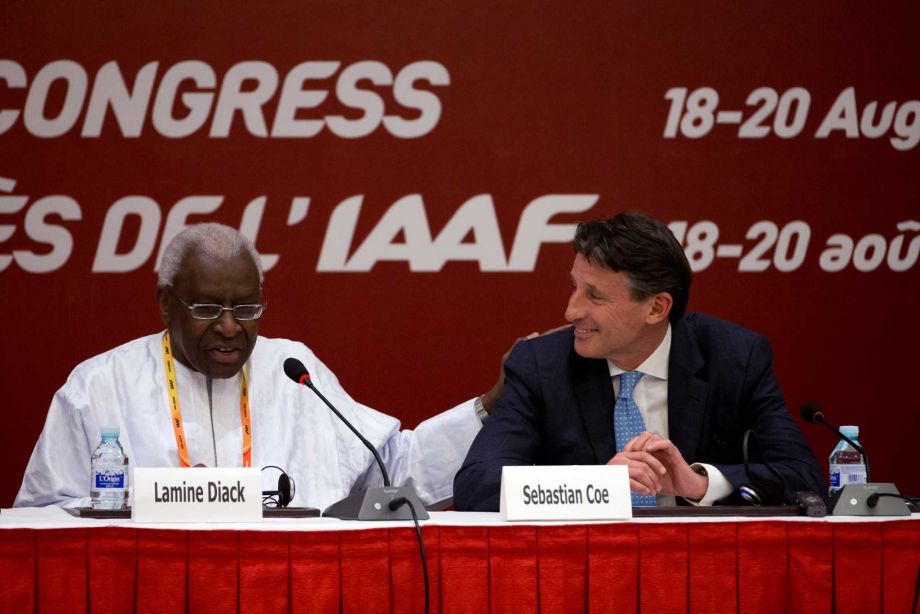 International Association of Athletics Federations outgoing president Lamine Diack left speaks next to newly elected president Sebastian Coe during a press briefing at the IAAF Congress at the National Convention Center in Beijing Wednesday Aug. 19 2