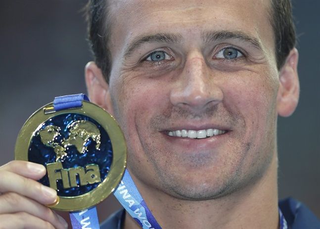 United States Ryan Lochte holds up his gold medal after winning the men's 200m individual medley final at the Swimming World Championships in Kazan Russia Thursday Aug. 6 2015