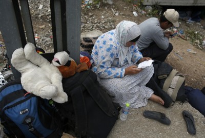 Chaos at Macedonian train station packed with migrants