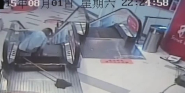 Video surveillance footage shows him cleaning with a mop before one of the escalator's metal floor panels give way trapping his left lower leg