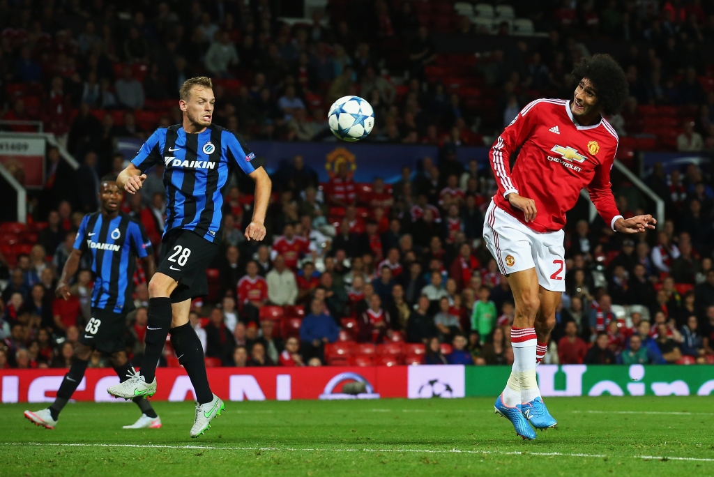 A late goal from marouane fellaini R) gave Manchester United extra cushion heading into the second leg against club Brugge