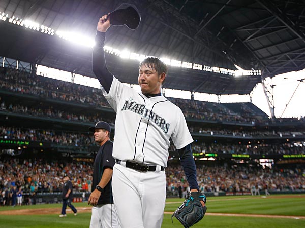 Seattle Mariners pitcher Hisashi Iwakuma tips his cap to the fans following the final out of his no-hit 3-0 victory against the Baltimore Orioles at Safeco Field