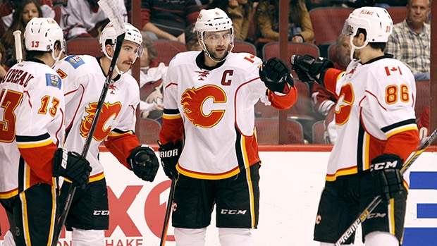 Mark Giordano centre was leading all NHL defencemen in points before an injury cut his season short