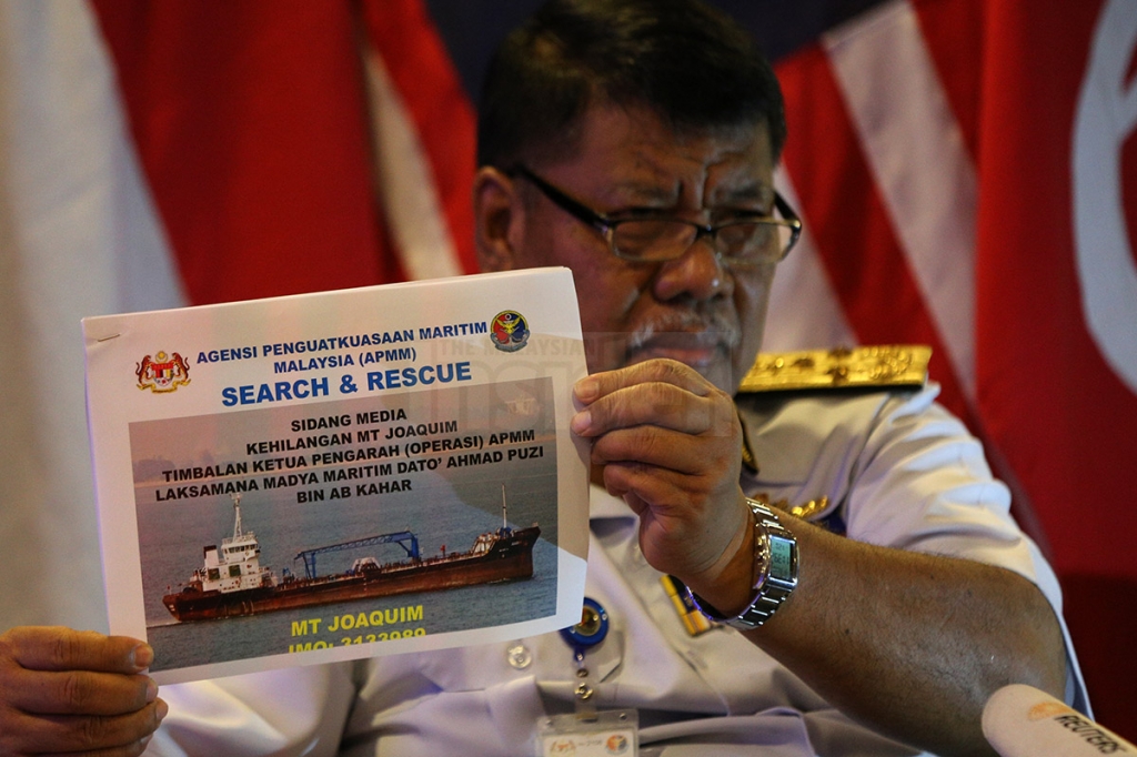 Malaysian Maritime Enforcement Agency deputy director Datuk Ahmad Puzi Ab Kahar showing reporters the