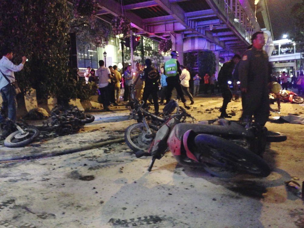 Motorcycles are strewn about after an explosion in Bangkok Monday