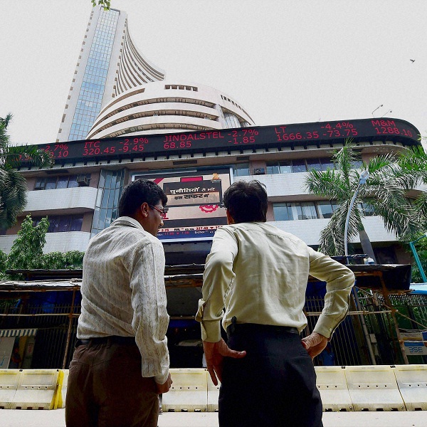 Mumbai: Investors react while watching stock prices at the BSE as the sensex declines by nearly 1000 points in Mumbai on Monday.          PTI