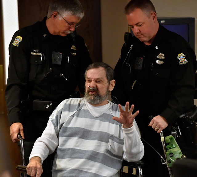 Frazier Glenn Cross is wheeled out of a Johnson County courtroom. He will go on trial Monday for the 2014 deaths of William Lewis Corporon 69 and his grandson Reat Griffin Underwood 14 and Terri LaManno 53