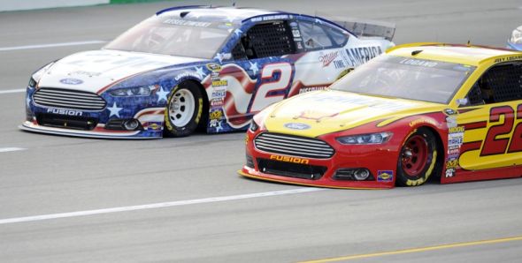 Jun 28 2014 Sparta KY USA NASCAR Sprint Cup Series driver Brad Keselowski and Joey Logano battle for position during the Quaker State 400 at Kentucky Speedway. Mandatory Credit Christopher Hanewinckel-USA TODAY Sports