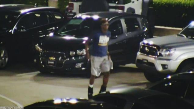 Security footage shows Christian Taylor of Arlington Texas 19 sneaking into a closed Classic GMC-Buick dealership Friday and jumping up and down on a car