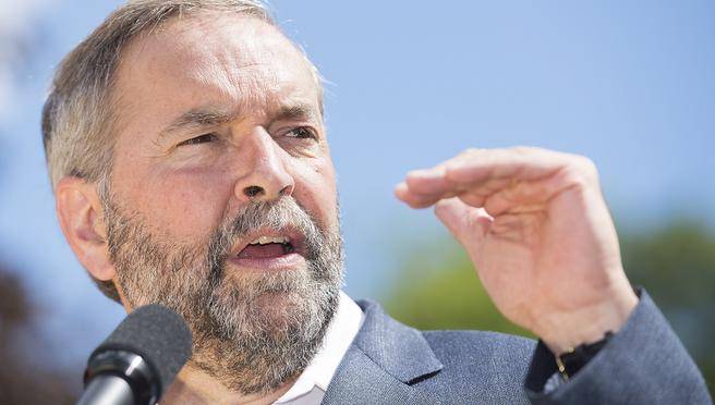 NDP Leader Thomas Mulcair speaks to supporters during a federal election campaign stop in Saint Jerome Que