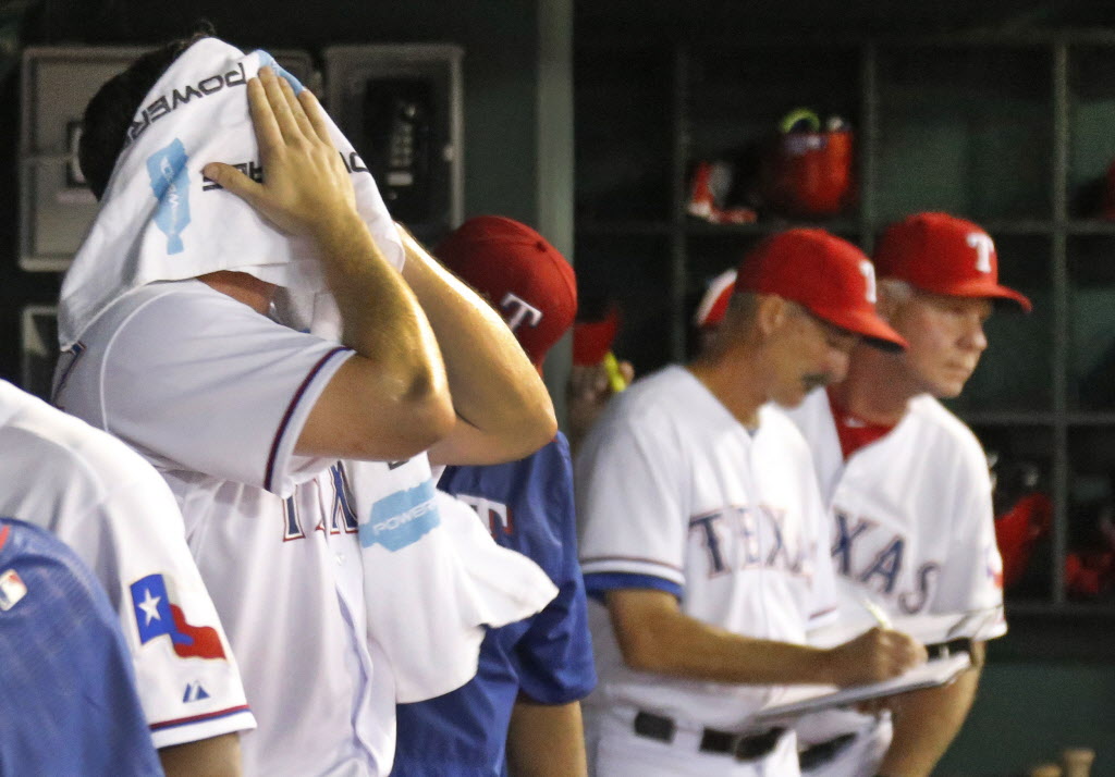 Texas Rangers starting pitcher Chi Chi Gonzalez towels off in the dugout after being pulled in the ninth inning after giving up a game tying two-run homer to Los Angeles Dodgers third baseman Justin Turner during the Los Angeles Dodgers vs. the