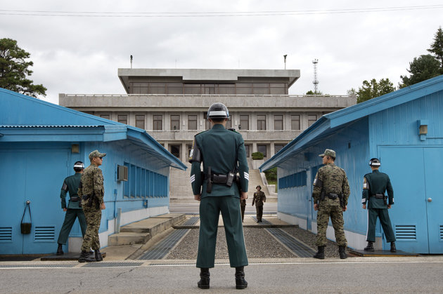 South Korea's military on Monday threatened retaliation against North Korea after accusing the North of planting land mines inside the Demilitarized Zone border that wounded two soldiers last week