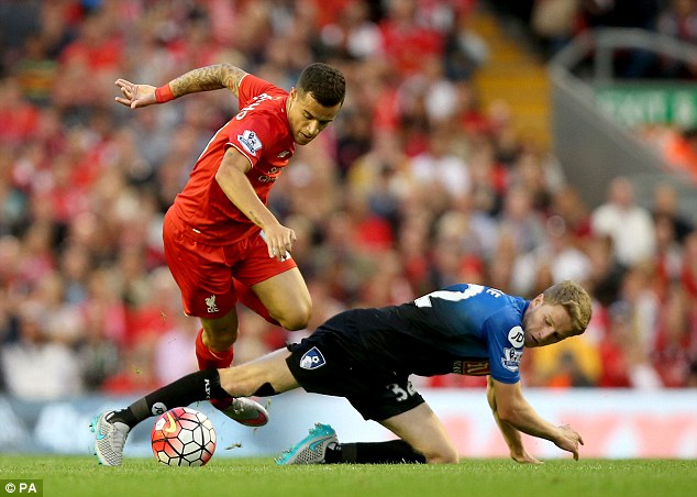 O'Kane attempts a tackle on Philippe Coutinho having featured in Bournemouth's 1-0 Barclays Premier League defeat by Liverpool on Monday