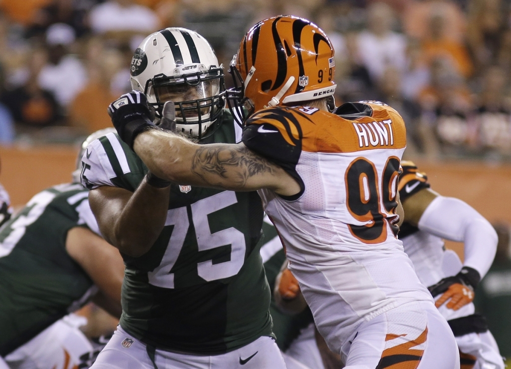 New York Jets offensive tackle Oday Aboushi works against Cincinnati Bengals defensive end Margus Hunt during an NFL preseason football game in Cincinnati Aboushi has been suspended one game without pay