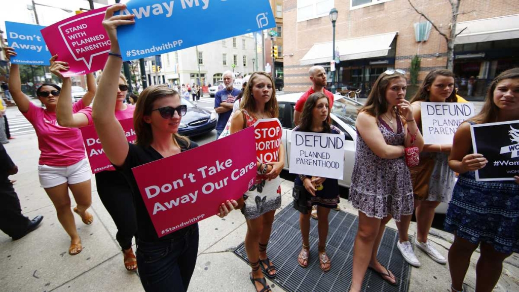 Opponents and supporters of Planned Parenthood demonstrate last month in Philadelphia