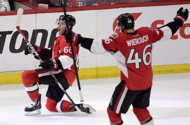 Ottawa Senators Mike Hoffman celebrates scoring on the Montreal Canadiens with teammate Patrick Wiercioch during third period Stanley Cup NHL playoff hockey action in Ottawa