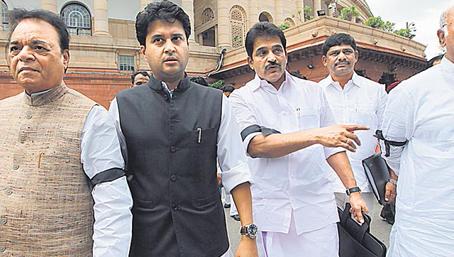 Cong leaders with black bands on their arms at Parliament house during the monsoon session in New Delhi