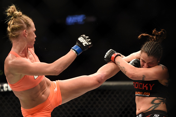 Holly Holm kicks Raquel Pennington at the UFC 184 event at Staples Center