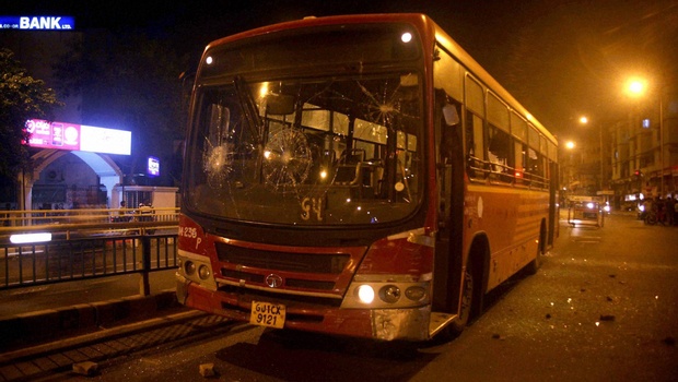 A bus damaged by people after the arrest of Hardik Patel convener of'Patidar Anamat Andolan Samiti in Ahmedabad | PTI