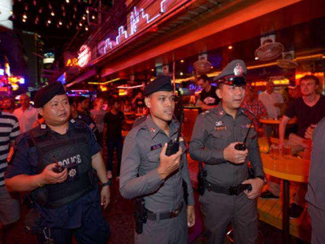 A man prays at the Erawan Shrine at Rajprasong intersection in Bangkok Thailand Wednesday Aug. 19 2015. The central Bangkok shrine reopened on Wednesday after Monday's bomb blast to the public as authorities searched for a man seen in a grainy