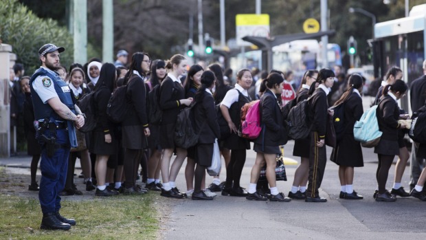 Police watch as pupils leave Sydney Girls High School