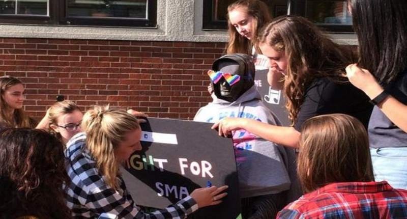 Students at St. Mary's Academy in Portland dress up the school statue to protest after the school rescinded its job offer to a gay counselor on Aug. 26 2015