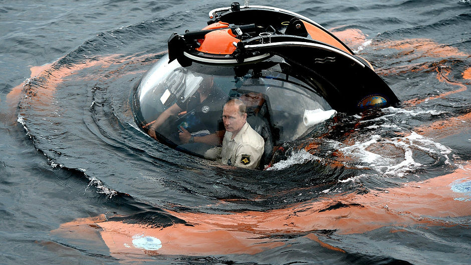 ALTERNATIVE CROP OF MOSB102 Russian President Vladimir Putin right sits on board a bathyscaphe as it plunges into the Black sea along the coast of Sevastopol Crimea Tuesday Aug. 18 2015. President Vladimir Putin plunged into the Black Sea to see the