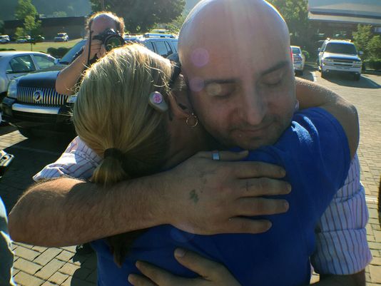 William Smith Jr. received a hug Aug. 27 2015 from supporter Sarah Anderson as he headed into the Rowan County Courthouse to get a marriage license with his partner James Yates