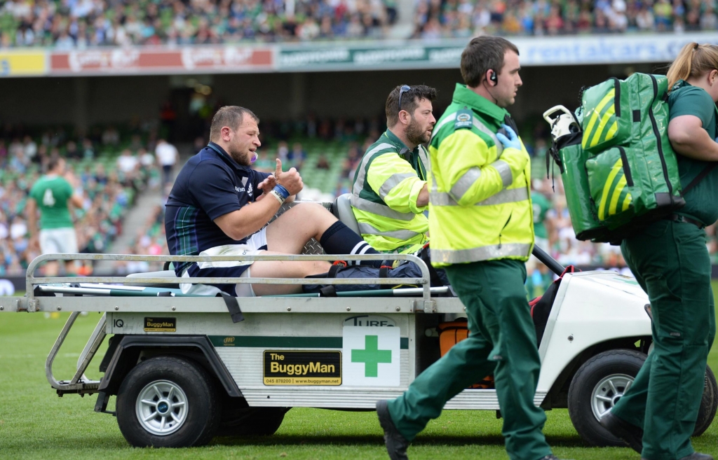 Ryan Grant gives the thumbs up as he is taken off injured against Ireland