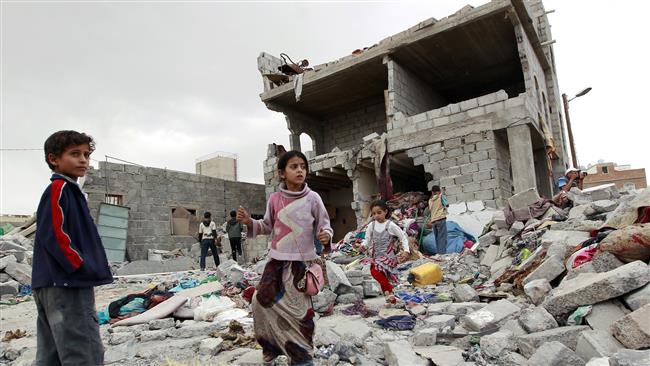 Yemeni children stand amid the rubble of buildings targeted in a Saudi airstrike on the capital Sana’a