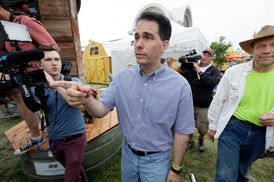 Republican presidential candidate Wisconsin Gov. Scott Walker greets fairgoers during a visit to the Iowa State Fair Monday Aug. 17 2015 in Des Moines Iowa