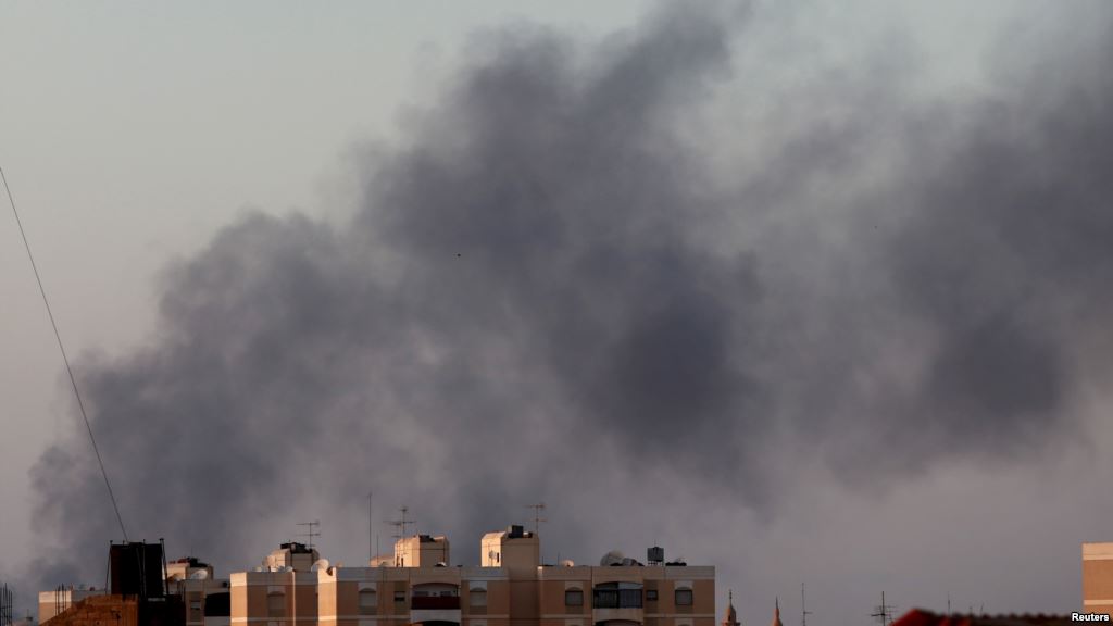 Black smoke marks where clashes are taking place between pro-government forces and an alliance of former anti Gaddafi rebels who have joined forces with the Islamist group Ansar al Sharia in Benghazi Libya Aug. 15 2015