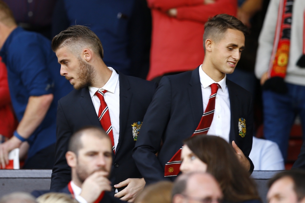 Manchester United goalkeeper David de Gea seen here with Adnan Januzaj in the directors box during the club’s season debut may be on his way to Real Madrid. – Reuters pic