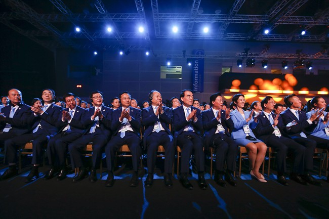 Members of the Chinese delegation clap hands during the Beijing's bid presentation for the host city for the 2022 Winter Games at the 128th International Olympic Committee session in Kuala Lumpur Malaysia Friday