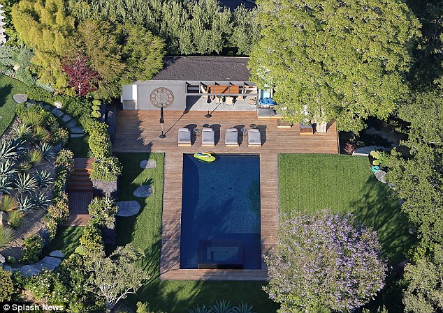 Stunning abode Aniston and Theroux's $22m mansion in Bel Air has been decked out with tables and chairs