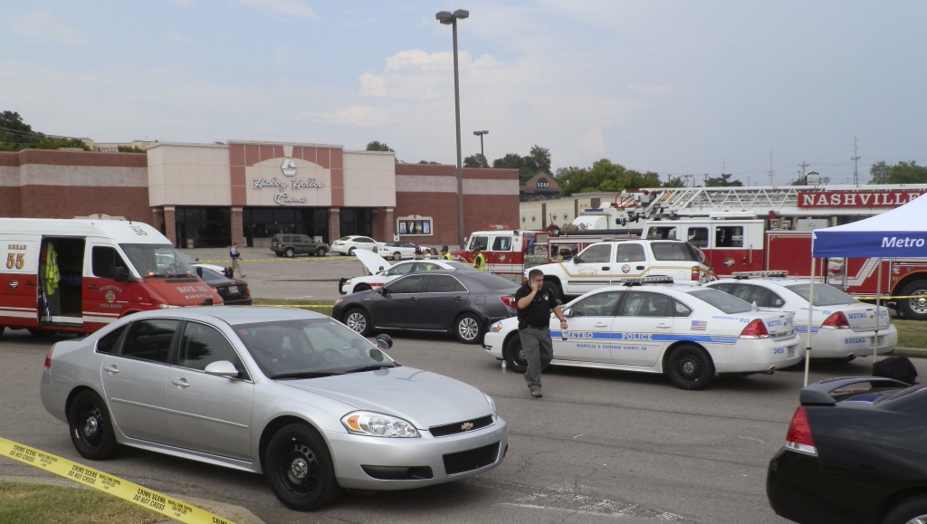 Emergency vehicles and personnel fill the parking lot outside of a Nashville-area cinema where a gunman wearing a surgical mask opened fire at a showing of the movie ‘Mad Max Fury Road’ in Nashville Tennessee yesterday. – Reuters pic